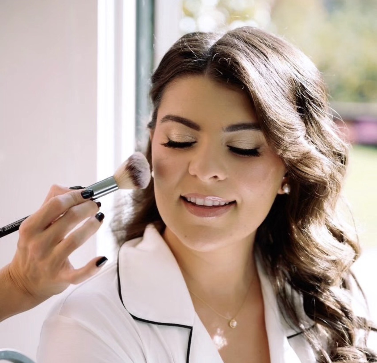Brittany Garruto applying bridal makeup